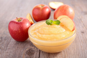 Home care assistance can help aging seniors adjust to softer foods like applesauce.