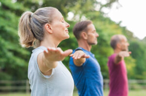 24-hour home care can help aging seniors stay active with nutrition and exercising, like yoga.